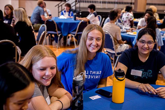 First-year students sitting together at a table